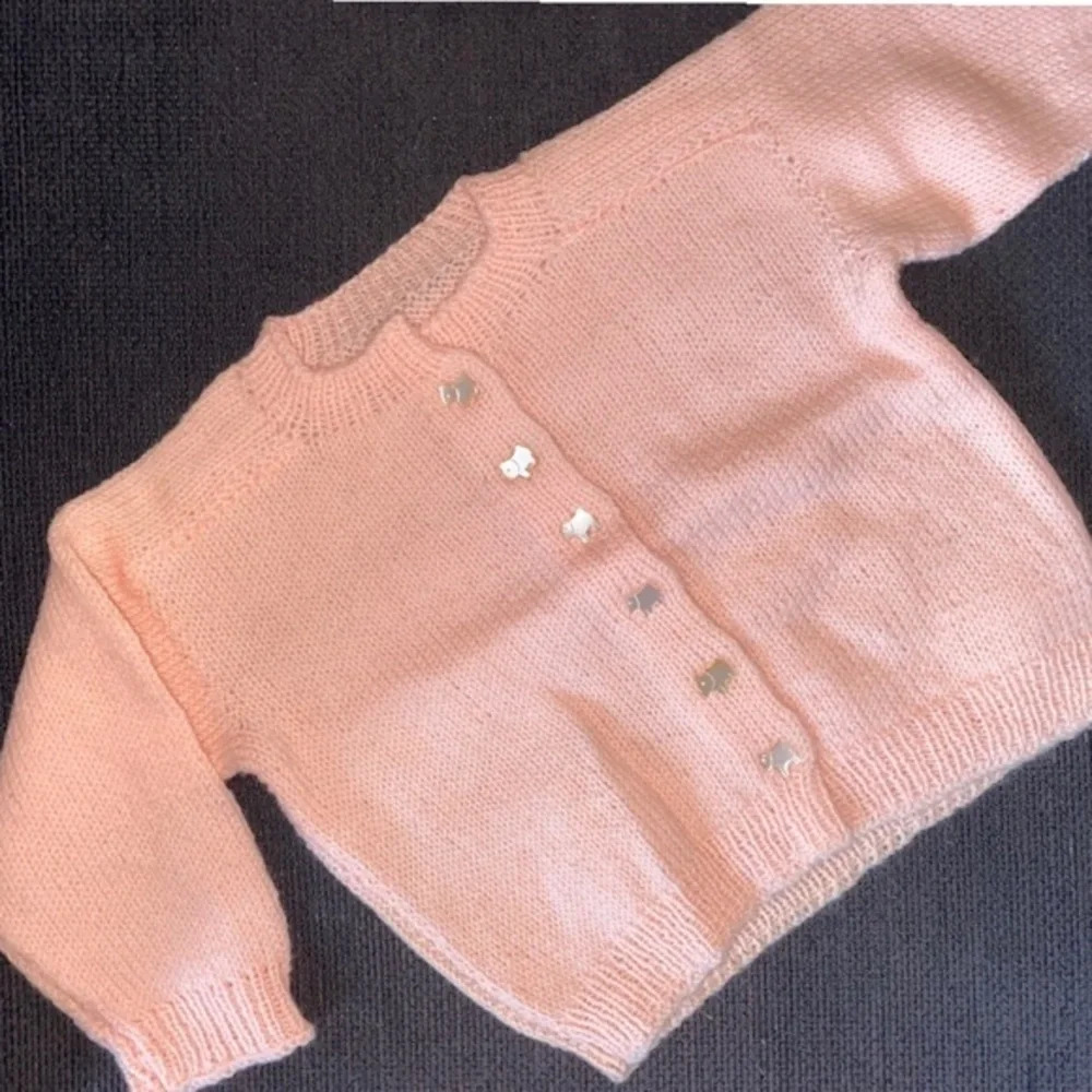 Pink hand knit sweater with dog buttons​